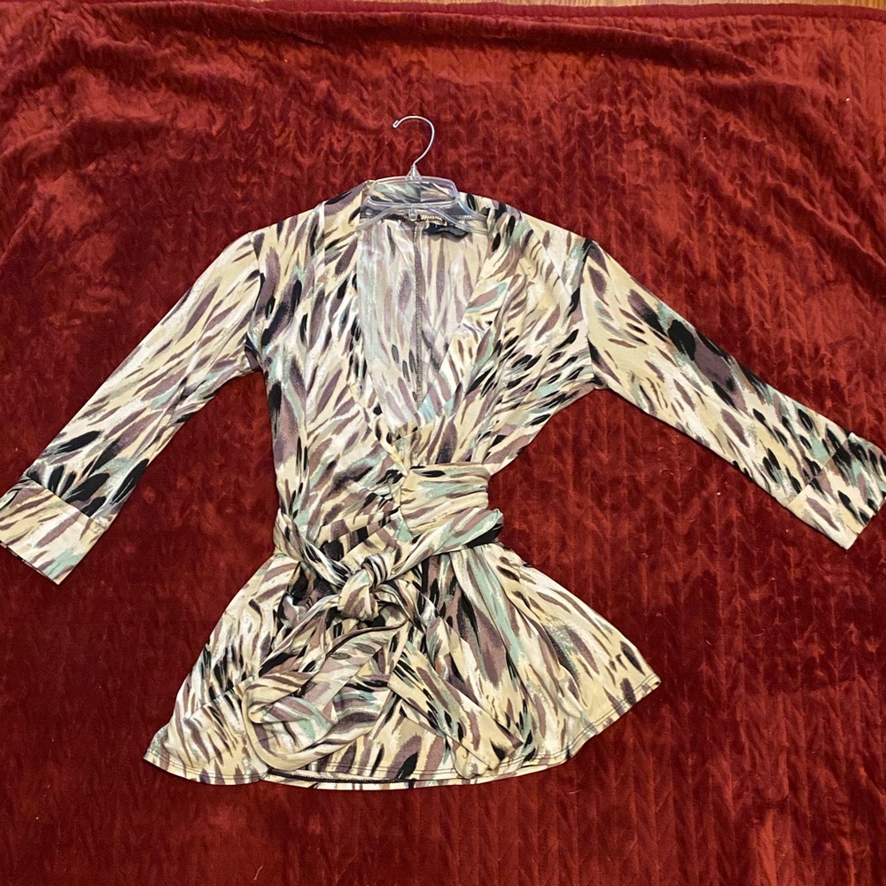 Lady’s multicolored wrap around blouse.